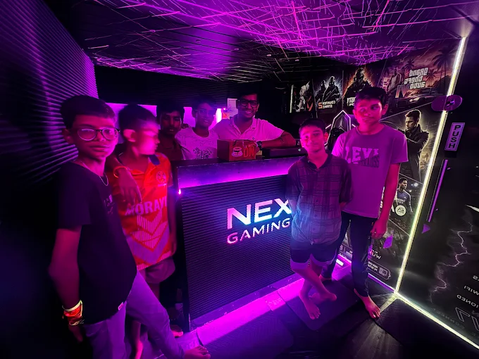 PS5 console lounge with OLED screen and recliner seating at Nexus Gaming Cafe Ulwe